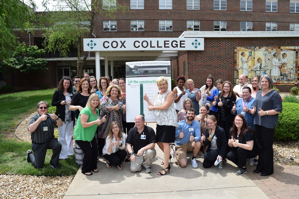 Cox College officials tally the final dollars for its fundraising campaign.